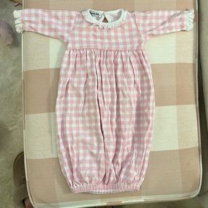Gingham newborn gown with ruffle detail.